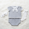 Grey baby girl knitted set on white background
