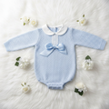 Blue baby boy knit romper on white background